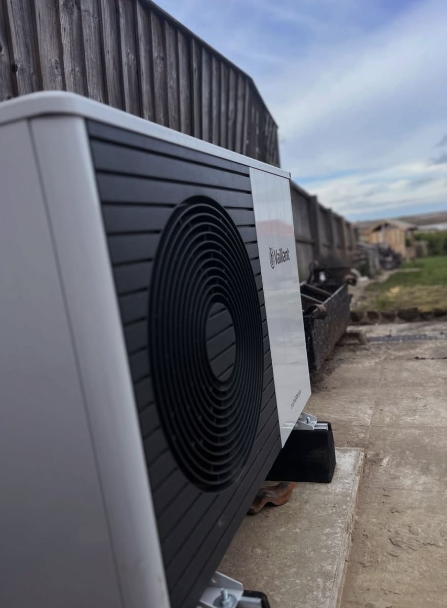 Close-up of a Vaillant heat pump outdoor unit on mounting feet